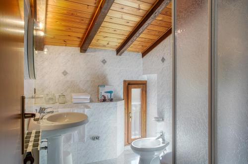 a bathroom with a sink and a toilet at Casa Dany in Malcesine