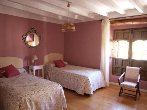 En eller flere senge i et værelse på CASA REHABILITADA SIGLO XVIII