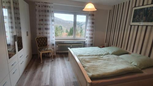 Ένα ή περισσότερα κρεβάτια σε δωμάτιο στο Schloßberg Ferienwohnung