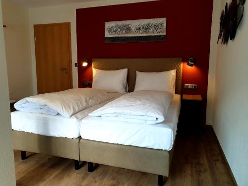Ένα ή περισσότερα κρεβάτια σε δωμάτιο στο Hotel Gasthof zum Schwan