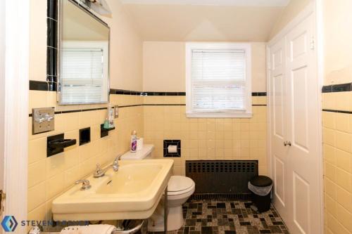 a bathroom with a sink and a toilet at Town Plot Waterbury in Waterbury