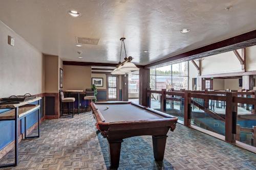 a pool table in the middle of a room at Crystal Peak Lodge By Vail Resorts in Breckenridge