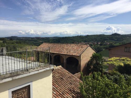 a building with a tile roof on top of a building at Viaggio della Vita B&B in Fontanile