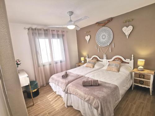 Ліжко або ліжка в номері Puerta del Sol casa Lily Caleta de Fuste