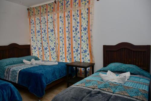 Cama o camas de una habitación en Hotel Yara