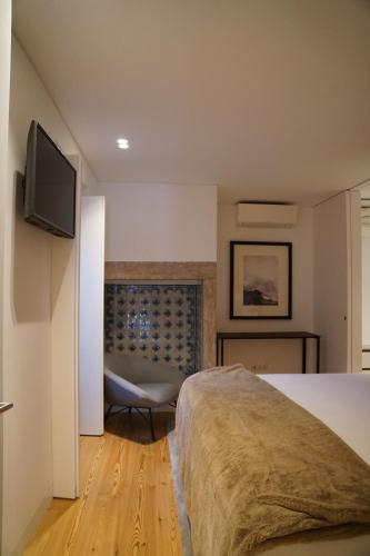 Katil atau katil-katil dalam bilik di Flora Baixa Apartments
