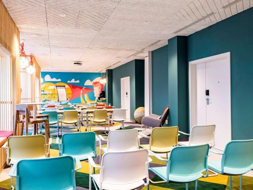 an empty waiting room with chairs and tables at ibis Styles Warszawa Centrum in Warsaw
