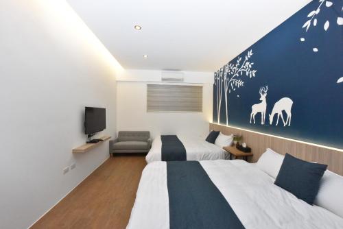 Ένα ή περισσότερα κρεβάτια σε δωμάτιο στο 巢棧The Nest Inn 包棟民宿