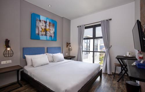 Ένα ή περισσότερα κρεβάτια σε δωμάτιο στο The Aswana Seminyak