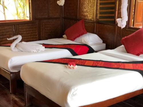 Voodi või voodid majutusasutuse Mekong Riverside Lodge toas
