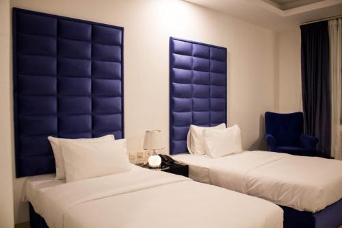 Cama o camas de una habitación en Parkside Plaza Muscat