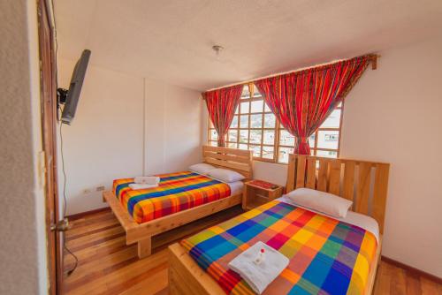 Tempat tidur dalam kamar di El Andariego