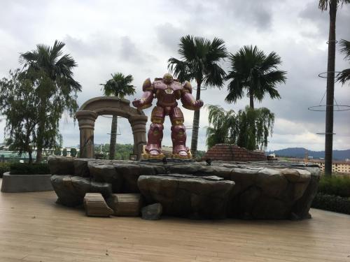 a statue of a superhero standing in front of a fountain at Studio I-Soho D'Gunduls Homestay by DGH I-CITY in Shah Alam