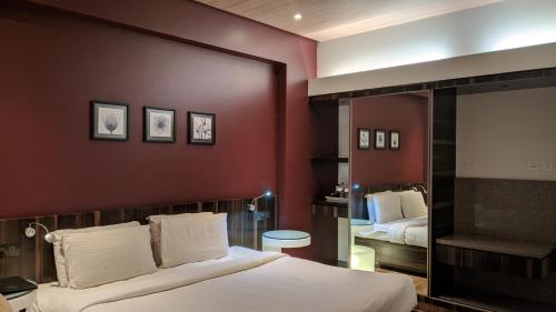 Cama o camas de una habitación en Hotel Sankam Residency