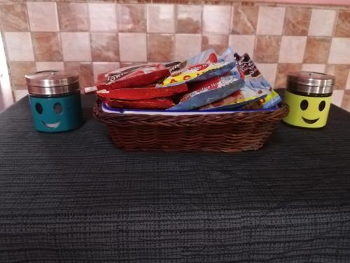 two baskets of food and two cups on a table at Agimats Crib Palawan in Puerto Princesa City