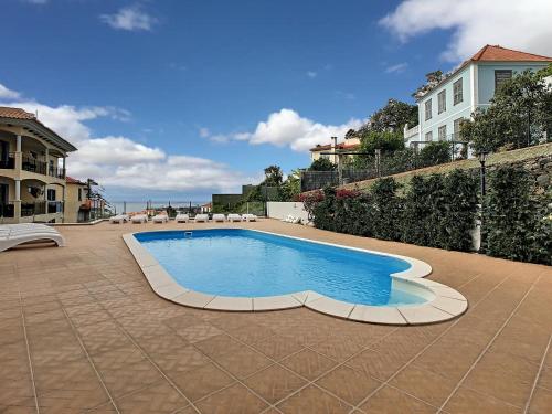 a swimming pool in the middle of a patio at Apartment Lotus by LovelyStay in Funchal
