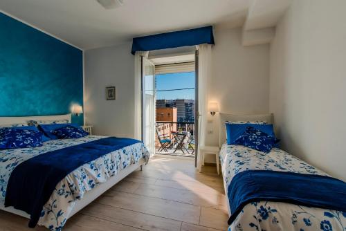 מיטה או מיטות בחדר ב-Le vestali Guest House