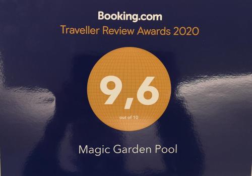 a yellow circle with the words magic garden pool at Magic Garden with Jacuzzi-Pool and Luxury Lake Como view in Lenno