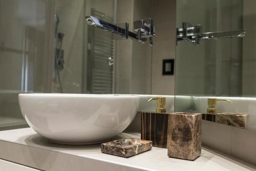 a bathroom with a white sink and a mirror at Crystal skyline neapolis in Naples