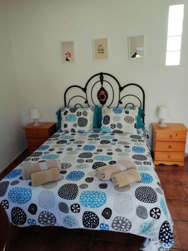 a bedroom with a bed with two stuffed animals on it at Casa el pinillo in San Nicolás