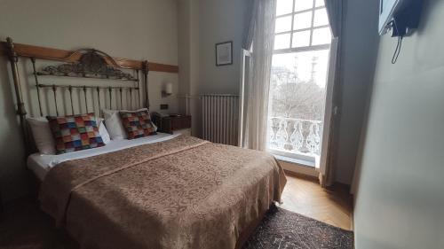 Postel nebo postele na pokoji v ubytování Turkoman Hotel