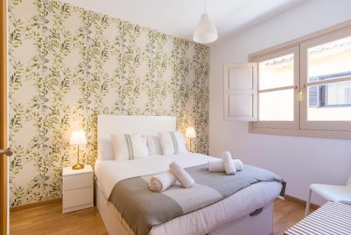 Posteľ alebo postele v izbe v ubytovaní Mitjana by ELE Apartments