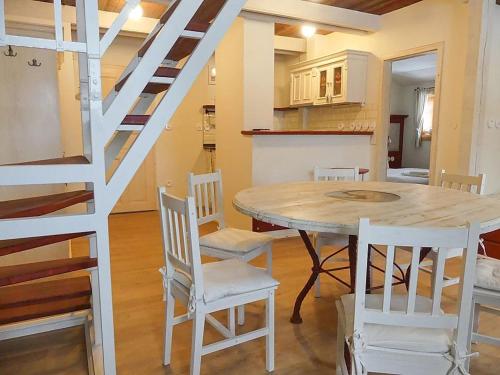 a kitchen and dining room with a table and chairs at Stará škola in Dolní Malá Úpa