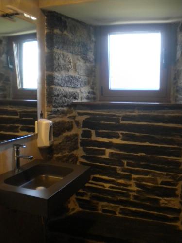 a room with a sink in the middle of a church at Casa de Aldea Araceli in Berducedo