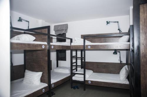 a group of bunk beds in a room at Kha Hostel in Hue