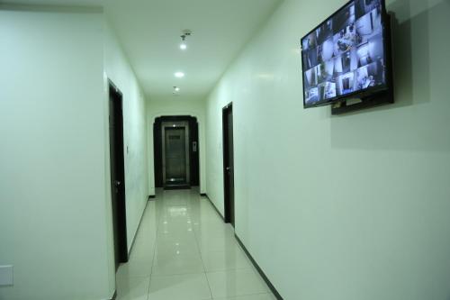 SRI JUPUDY RESIDENCYにあるテレビまたはエンターテインメントセンター