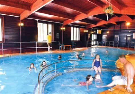 a group of people in a large swimming pool at 41 Tudor Court in Hayle