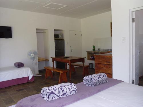 Postel nebo postele na pokoji v ubytování Bellevue Guest Lodge
