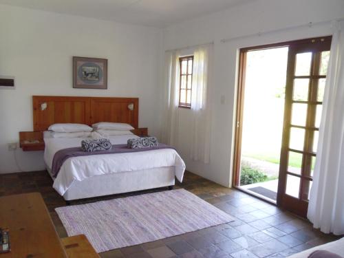 Postel nebo postele na pokoji v ubytování Bellevue Guest Lodge