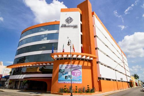 a building with a sign on the side of it at Hotel Ambassador Mérida in Mérida