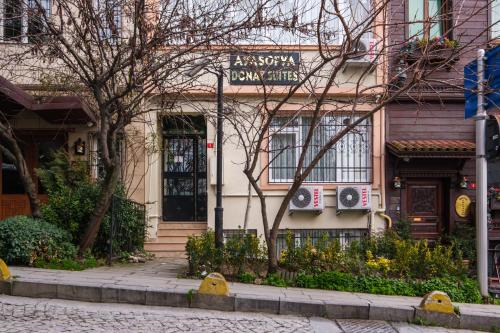 a house with a sign on the front of it at HagiaSophia Donat Suites in Istanbul