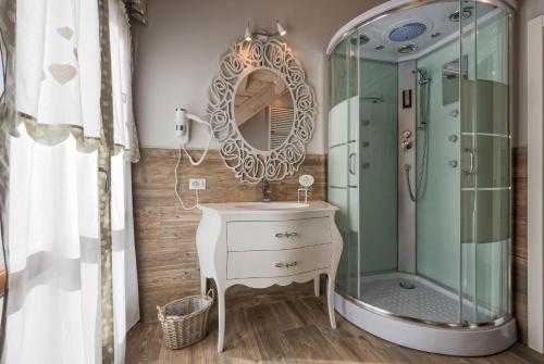 a bathroom with a sink and a shower at Locanda Zita in Sestola
