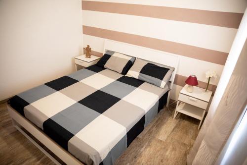 Postel nebo postele na pokoji v ubytování Appartamento Camisa