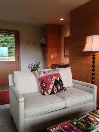 a living room with a couch with pillows on it at Trail Creek Ranch in Wilson
