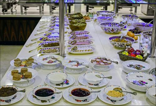 a buffet with bowls and plates of food on a table at Dosso Dossi Hotels Old City in Istanbul