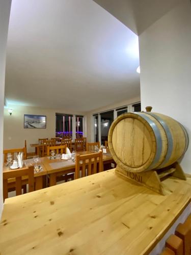 a wine barrel sitting on top of a wooden table at Hotel Toni in Gudauri