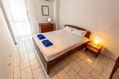 Ένα ή περισσότερα κρεβάτια σε δωμάτιο στο Ocean Breeze Apartment
