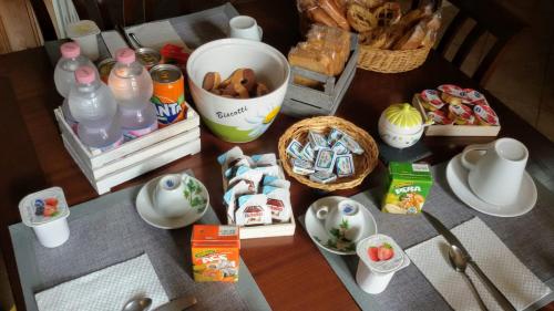 a table with food and other items on it at B&B Le Colonne in Montefusco