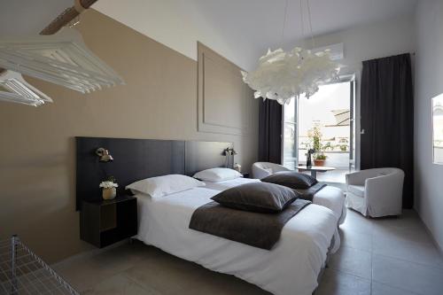 A bed or beds in a room at Penthouse with big terrace Duomo view