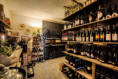 a room filled with lots of bottles of wine at Triad Wiener Alpen Bett DZ in Bad Schönau