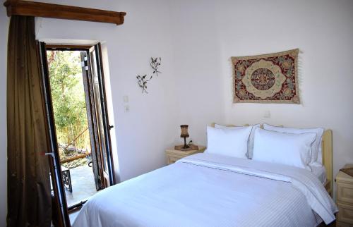 Postel nebo postele na pokoji v ubytování Eufrosini Guesthouse