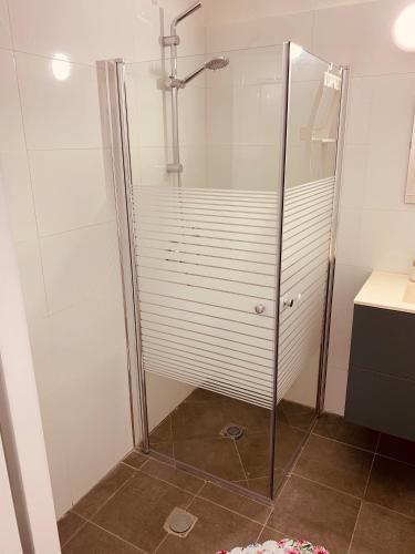 a shower with a glass door in a bathroom at BEAUTIFUL PRIVATE in Beer Sheva