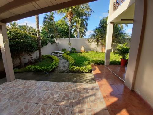 a view of a yard from the outside of a house at Hotel Bethlehem in La Lima