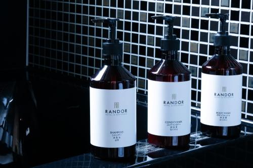 three bottles of wine sitting on top of a counter at Randor Hotel Sapporo Suites in Sapporo