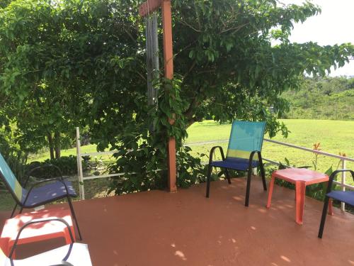 a group of chairs and a table on a porch at Tranquility by the Sea in Vieques