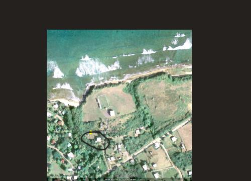 an aerial view of a park with the ocean at Tranquility by the Sea in Vieques